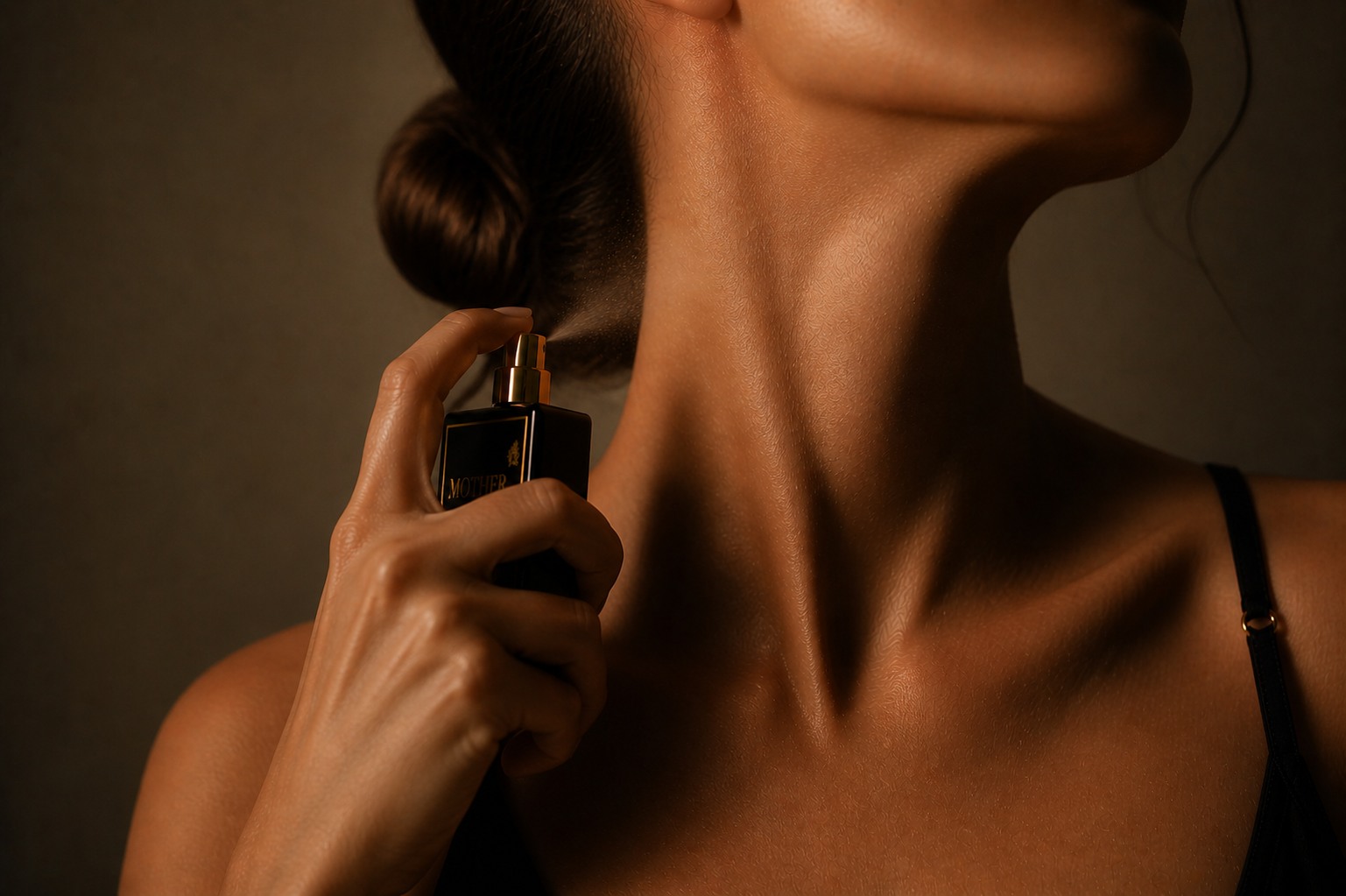 MOTHER held close — a soft spray at the neck, intimacy over projection.